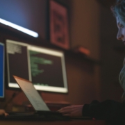 Free Side View of a Woman Using a Laptop Stock Photo