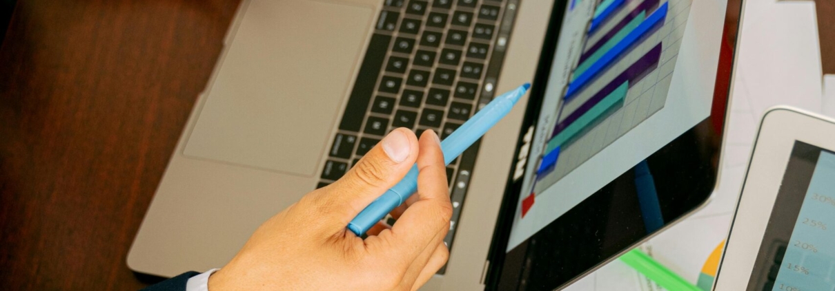 Free A Person in Black Suit Holding a Pen Stock Photo