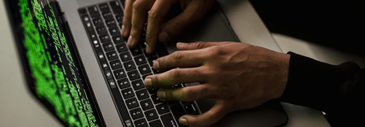 crop-cyber-spy-hacking-system-while-typing-on-laptop