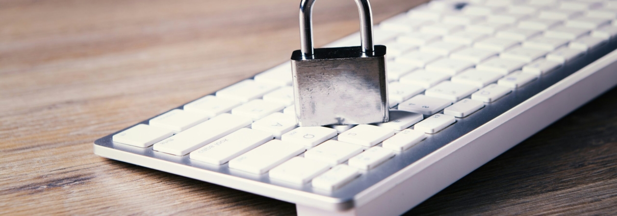 a computer keyboard with a padlock on top of it