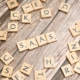 scrabble-letters-spelling-saas-on-a-wooden-tabl